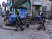 Security personnels guarding on street during curfew due to rise of COVID-19 coronavirus cases, in Guwahati, India on 11 May 2021.  India re...