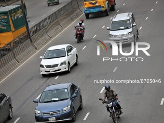 Bikers on a rush drive at a highway in Dhaka, Bangladesh on May 11, 2021. (