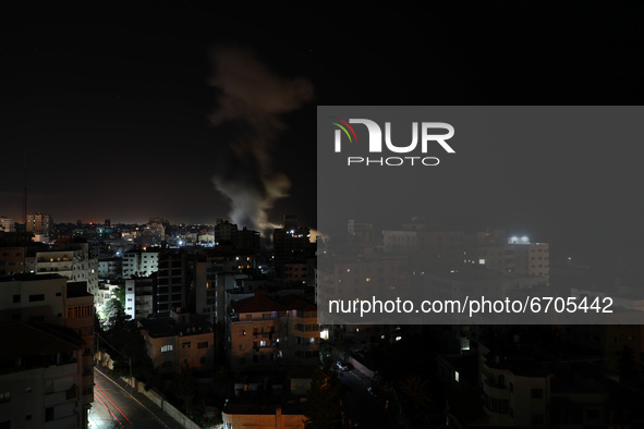 Smoke billows from Israeli air strikes in Gaza City, controlled by the Palestinian Hamas movement, on May 12, 2021. 