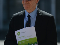 Frank Feighan, Minister of State for Public Health, Well Being and National Drugs Strategy, seen with a copy of the Healthy Ireland strategi...