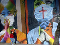 Mural 'Coexistencia - Memorial da Fé for all victims of Covid-19', by Brazilian graffiti artist Eduardo Kobra. The mural depicts children of...