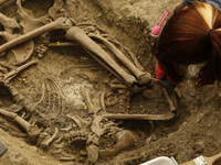 Forensic archaeologists work cleaning and exhuming three bodies found in a common grave on May 12, 2021 in Viznar (Granada), Spain.
An inter...