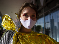 Climate activists gathered in front of one of Warsaw city center's shopping malls in a protest against ''fast fashion'' - rapidly changing t...