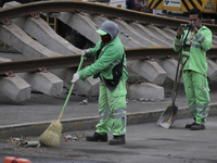 Cleanup workers at ground zero between Tezonco and Olivos stations on Line 12 of the Metro Collective Transport System in Mexico City, where...