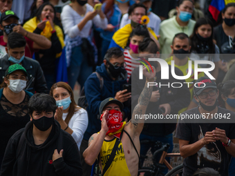 Demonstrators participate as thousands flood Bogota, Colombia on may 12, 2021 to protest against the government of president Ivan Duque and...