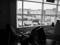 A passenger waits to board their next flight at Dallas-Fort Worth International Airport on April 12, 2021. As America’s COVID-19 vaccination...