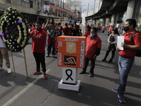 Members of the Francisco Villa Independent Popular Front march on Avenida Tláhuac to demand justice for the 26 people who died after a colum...