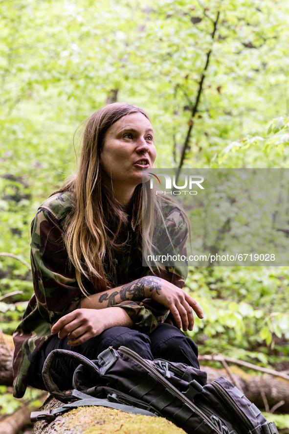 An environmental  activist, Edyta, 34, relaxes in Turnicki forest on May 14, 2021 near Arlamow, Carpathians mountains, south-eastern Poland....
