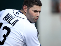 Detroit Tiger's Alex Avila warms up in the dugout having returned for his first game back after being on the disabled list of a baseball gam...