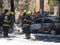 Police and rescue teams at the scene of a direct rocket hit, which was fired from the Gaza Strip, in Ramat Gan, causing the death of one Isr...