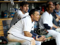 Detroit Tigers' Miguel Cabrera, front, and Nick Castellanos follows the third inning from the dugout of a baseball game against the Toronto...