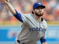 Toronto Blue Jays starting pitcher Drew Hutchison delivers a pitch in the third inning of a baseball game against the Detroit Tigers in Detr...