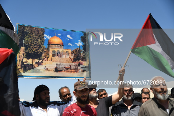 Syrians and Palestinians displaced from southern Damascus demonstrate in solidarity with Jerusalem and Gaza holding pictures of Al-Aqsa and...