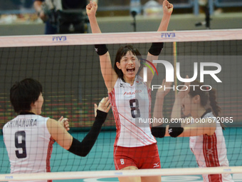Sarina Koga (C) of Japan reacts as her team winning a point during the FIVB World Grand Prix intercontinental round match against Thailand a...