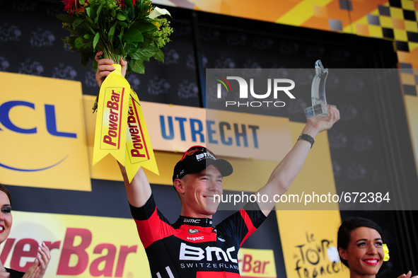 BMC Racing Team rider Rohan Dennis of Australia raises the trophy after winning Stage 1 of the Tour de France in Utrecht, Holland on July 4,...