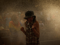 SPAIN, Madrid:People playing with water due to the heatwave in Spain during the 2015 gay pride parade in Madrid on July 4, 2015. ( 