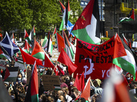Demonstrators show their support for Palestine during a demonstration against state violence in George Square on May 16, 2021 in Glasgow, Sc...