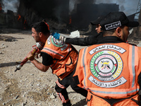 Palestinian firefighters douse a huge fire at the Foamco mattrss factory east of Jabalia in the northren Gaza Strip, ofollowing Israeli air...