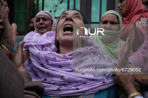Kashmiri woman wail outside the damaged residential house after encounter between Indian Forces and Alledged militants was over in Khonmuh a...