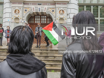 Protesters with flag of Palestina are seen in Gdansk, Poland, on 17 May 2021 Pro-Palestinian people protest demanding an end  demanding an e...