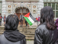 Protesters with flag of Palestina are seen in Gdansk, Poland, on 17 May 2021 Pro-Palestinian people protest demanding an end  demanding an e...