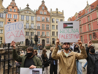 Protesters with pro-Palestinian banners and flags of Palestina are seen in Gdansk, Poland, on 17 May 2021 Pro-Palestinian people protest dem...
