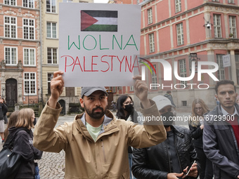 Protesters with pro-Palestinian banners and flags of Palestina are seen in Gdansk, Poland, on 17 May 2021 Pro-Palestinian people protest dem...