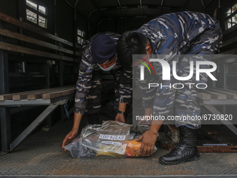 Indonesian Navy carries some parts from sunken Indonesian Navy submarine KRI Nanggala 402 after being showed during press conference at Indo...