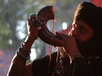 A Pakistani Muslims (Malang)devotee blows a horn at the shrine of Sufi saint Hazrat Shah Hussain, popularly known as Madhu Lal Hussain, in L...
