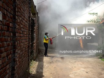 People try to extinguish a fire in a high-rise building at Kakrail in Dhaka, Bangladesh, on May 21, 2021. According to fire services, the fi...