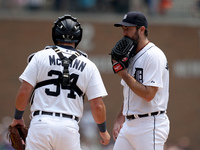 Detroit Tigers starting pitcher Justin Verlander talks to catcher James McCann during the fourth inning of a baseball game against the Toron...