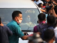 Investigative journalist Rozina Islam sits inside a car after she was granted bail and was released from a women's jail at Kashimpur, Gazipu...