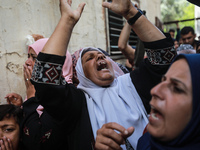 Relatives mourn local commander of the the Al-Aqsa Martyrs' Brigades, the armed wing of the Palestinian Fatah movement, Moeen al-Amsi during...