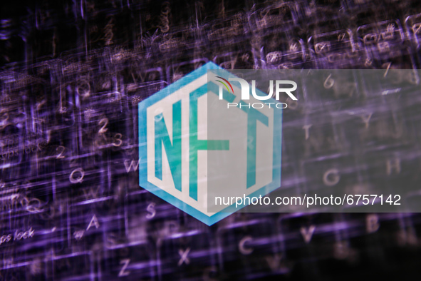 Non-fungible token - NFT logo displayed on a screen and a laptop keyboard are seen in this double exposure illustration photo taken in Krako...
