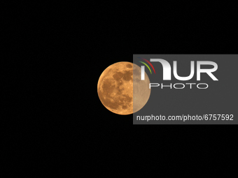 A full moon is seen after the total lunar eclipse in New Delhi, India on May 26, 2021. According to the IMD, the lunar eclipse was visible i...