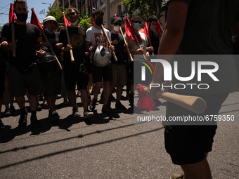  A student is holding a red flag during a protest  in Athens, Greece, on May 27, 2021. (