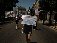 A student is holding a banner in Athens, Greece, on May 27, 2021. (