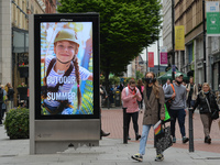 A street billboard with the words 'Think Outdoor This Summer' seen in the center of Dublin.
The next stage of defrosting the Irish economy a...