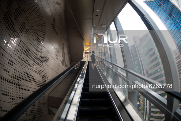 A man rides an escalator to the Eslite bookstore in Causeway Bay, in Hong Kong, China, on May 30, 2021. Eslite, member of a Taiwanese chain...