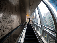 A man rides an escalator to the Eslite bookstore in Causeway Bay, in Hong Kong, China, on May 30, 2021. Eslite, member of a Taiwanese chain...