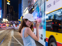 Young ladies take selfies in Causeway Bay, in Hong Kong, China, on May 30, 2021. (