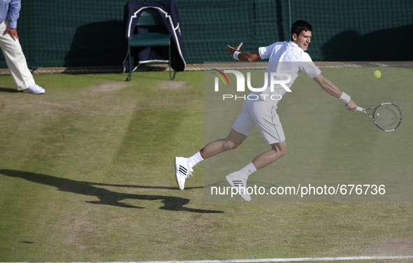 (150707) -- LONDON, July 6, 2015 () -- Novak Djokovic of Serbia hits a return to Kevin Anderson of South Africa during the men's singles fou...