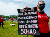 A student is holding a big placard against the student loan system, during the Nationwide student strike, organized in The Hague, Netherland...