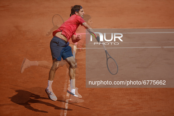 Roger Federer of Switzerland heats the ball during the second round match against Marin Cilic of Croatia during day five of the 2021 French...