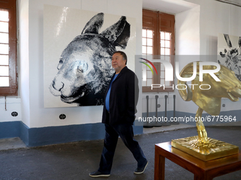 Chinese artist Ai Weiwei walks by his artworks during a press preview of his new exhibition 'Rapture'  at the Cordoaria Nacional in Lisbon,...