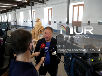 Chinese artist Ai Weiwei speaks to journalists during a press preview of his new exhibition 'Rapture'  at the Cordoaria Nacional in Lisbon,...