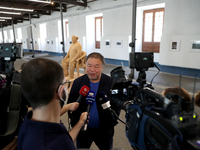 Chinese artist Ai Weiwei speaks to journalists during a press preview of his new exhibition 'Rapture'  at the Cordoaria Nacional in Lisbon,...