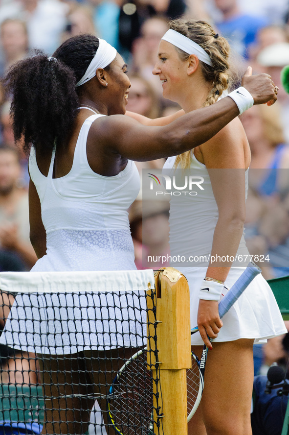 Serena Williams and Viktoria Azarenka embrace at the net following Serena's three sets victory during day eight of the Wimbledon Lawn Tennis...