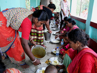 Villagers Lunch Break   in a village relief camp after Cyclone YAAS from regular tides while many embankments remain damaged in Kulpi , Kolk...