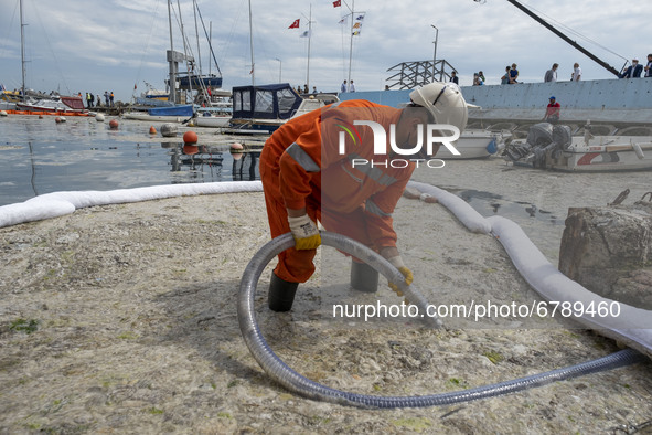 The photo shows the cleaning of mucilage covering the surface of the Sea of Marmara on the Turkish coast of Istanbul on June 8, 2021. In lin...